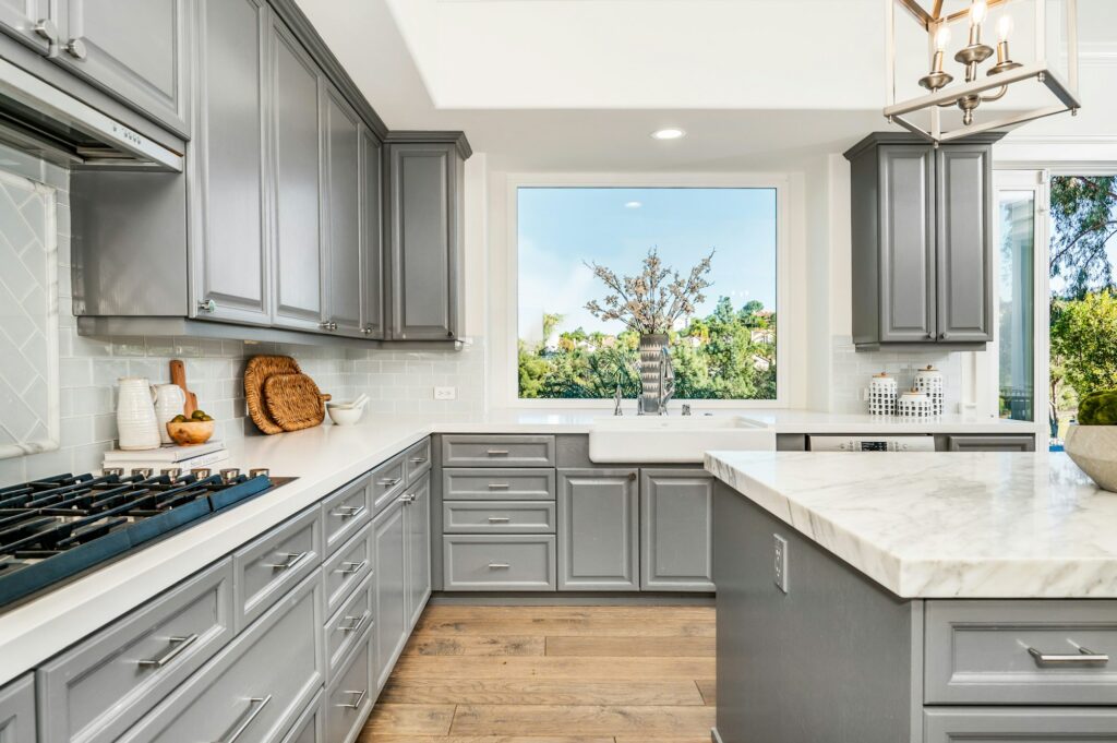 Modern marble kitchen with sleek gray cabinets